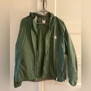 Used green north face raincoat